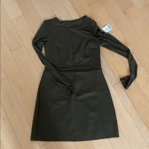 Green fitted dress with sheer accents and sleeves